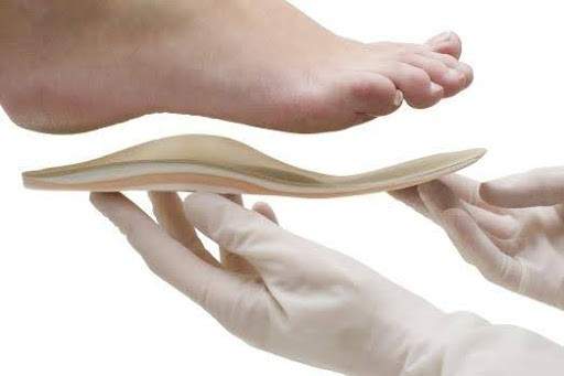 A foot being fitted for orthotics